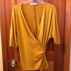 New without tags gold top. Size large